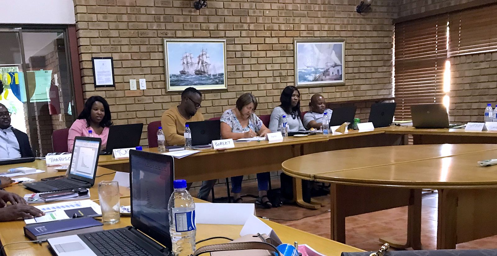 Participants working at a Shared iQ in-house session